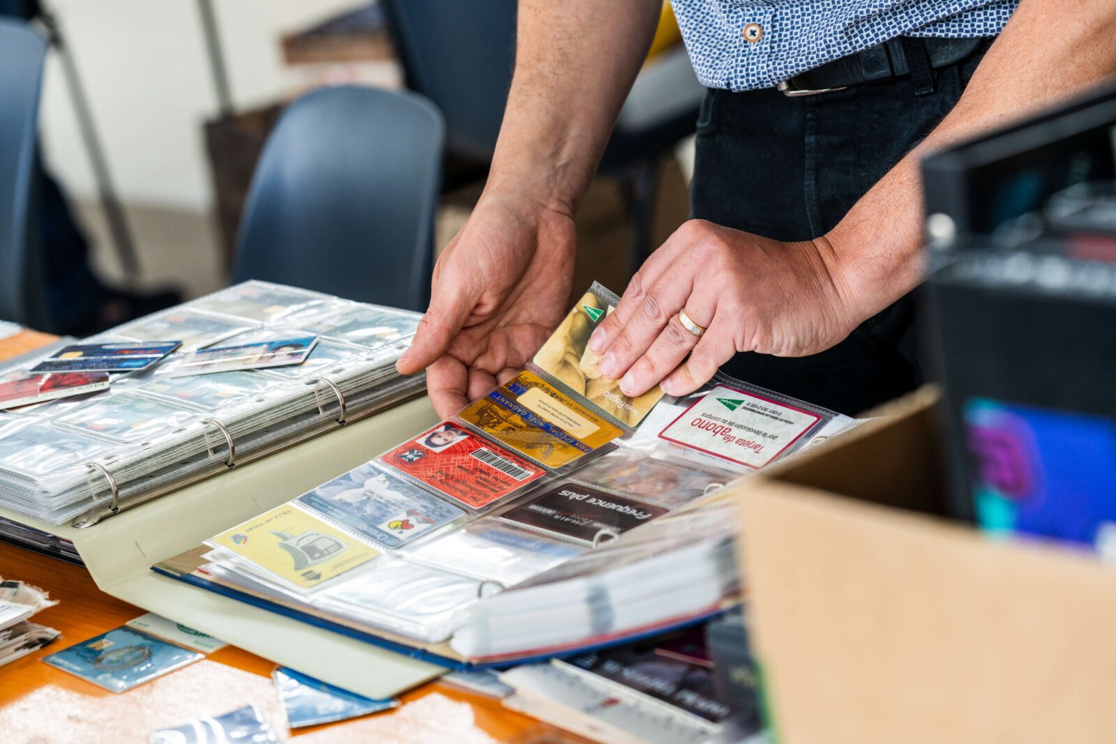 Collector sharing phonecards from binder, how to take part in the WPC Club Contribute to History project
