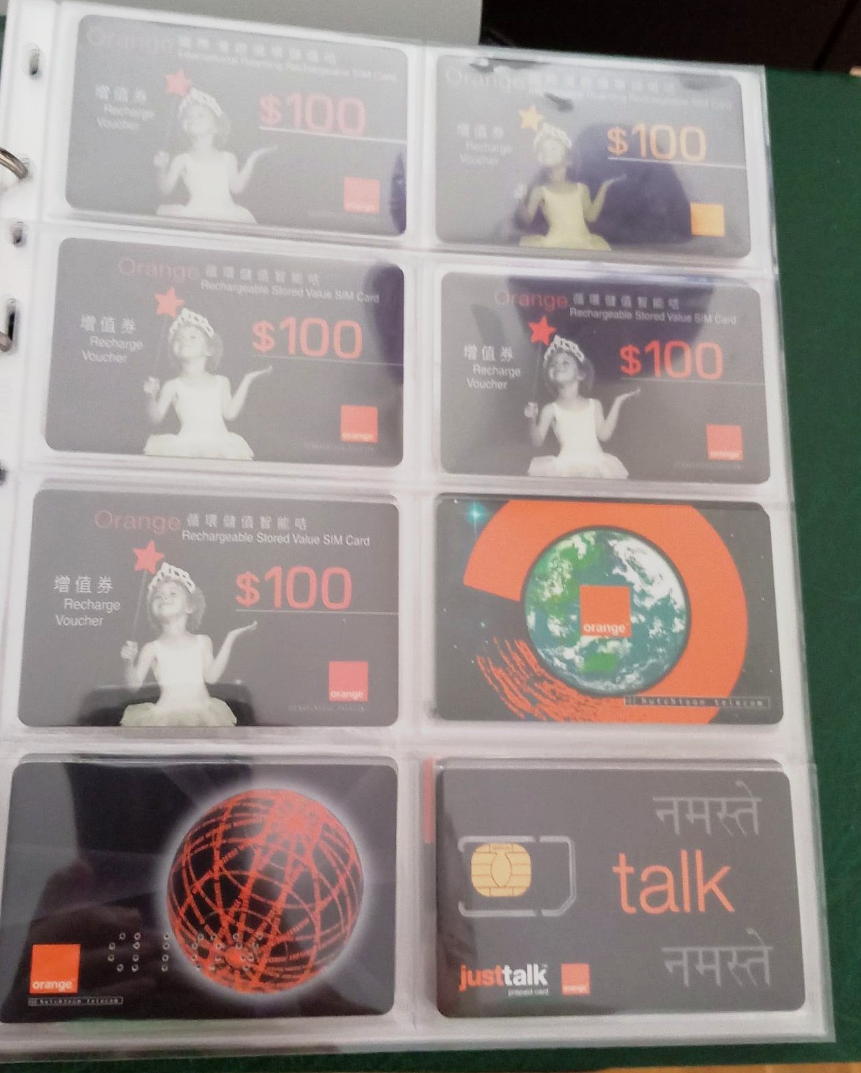 Orange SIM and recharge cards collected by François Fossard across five continents