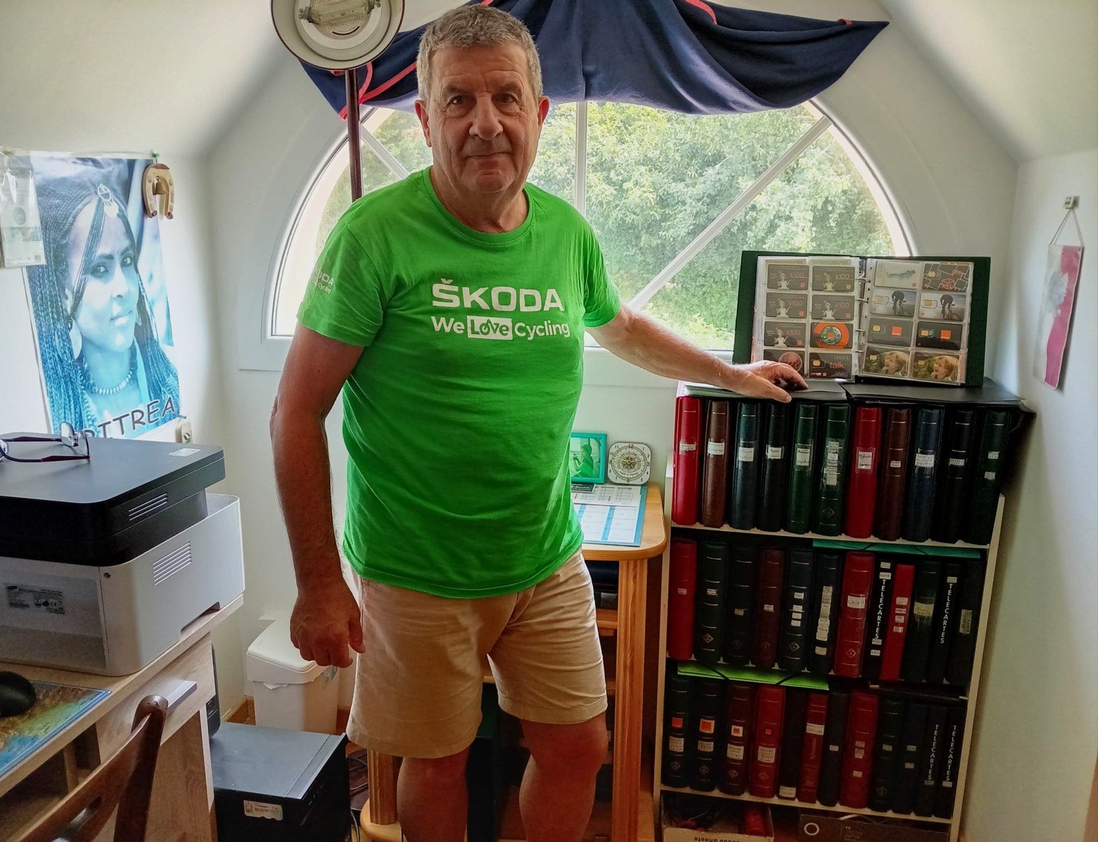 François Fossard with his worldwide phonecard collection of binders and albums