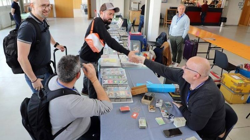 Phonecard collectors exchanging cards at PIM 2025 – the introducing member feature connects new and existing members of the WPC Club