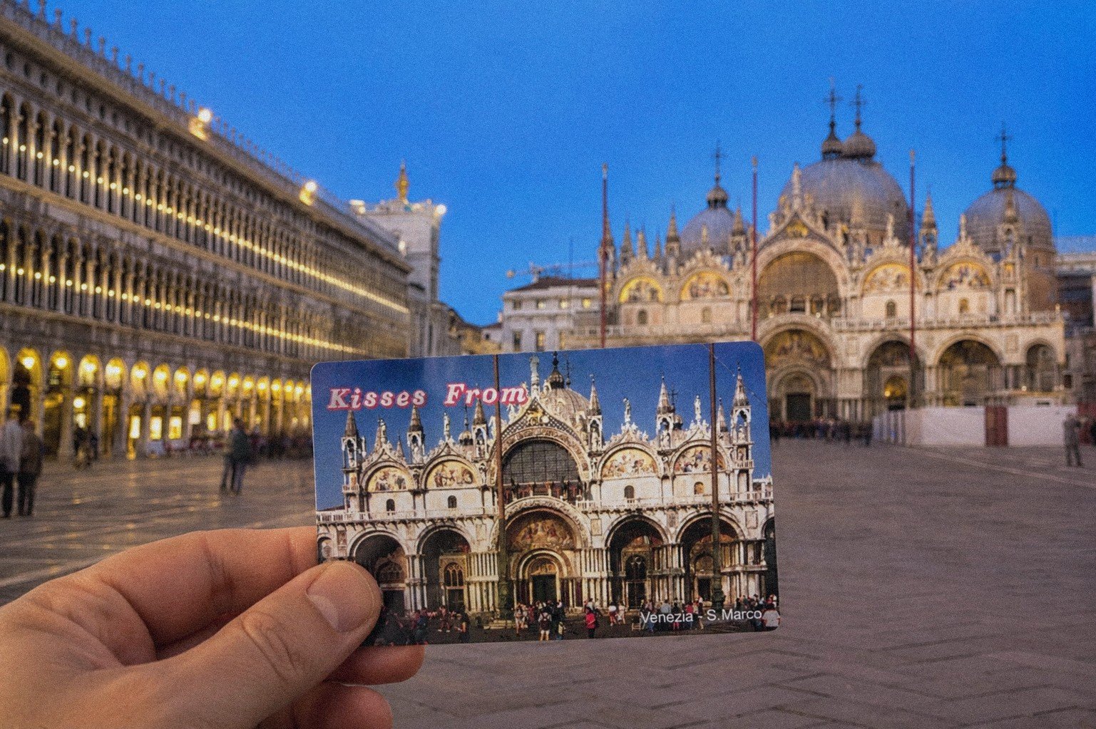 Phonecards on holiday: a Venice phonecard held in front of St Mark's Basilica