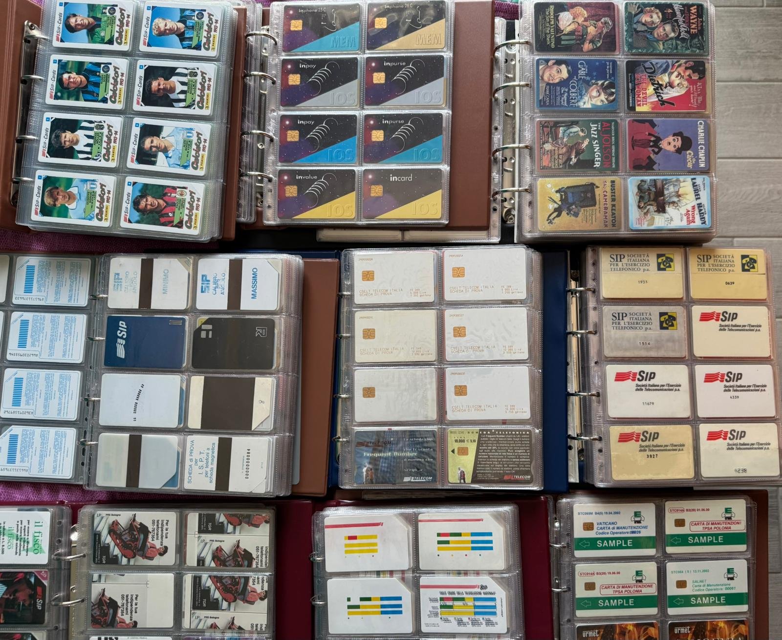 Open binders of Italian SIP and Telecom phonecards from Andrea Franzoni's collection