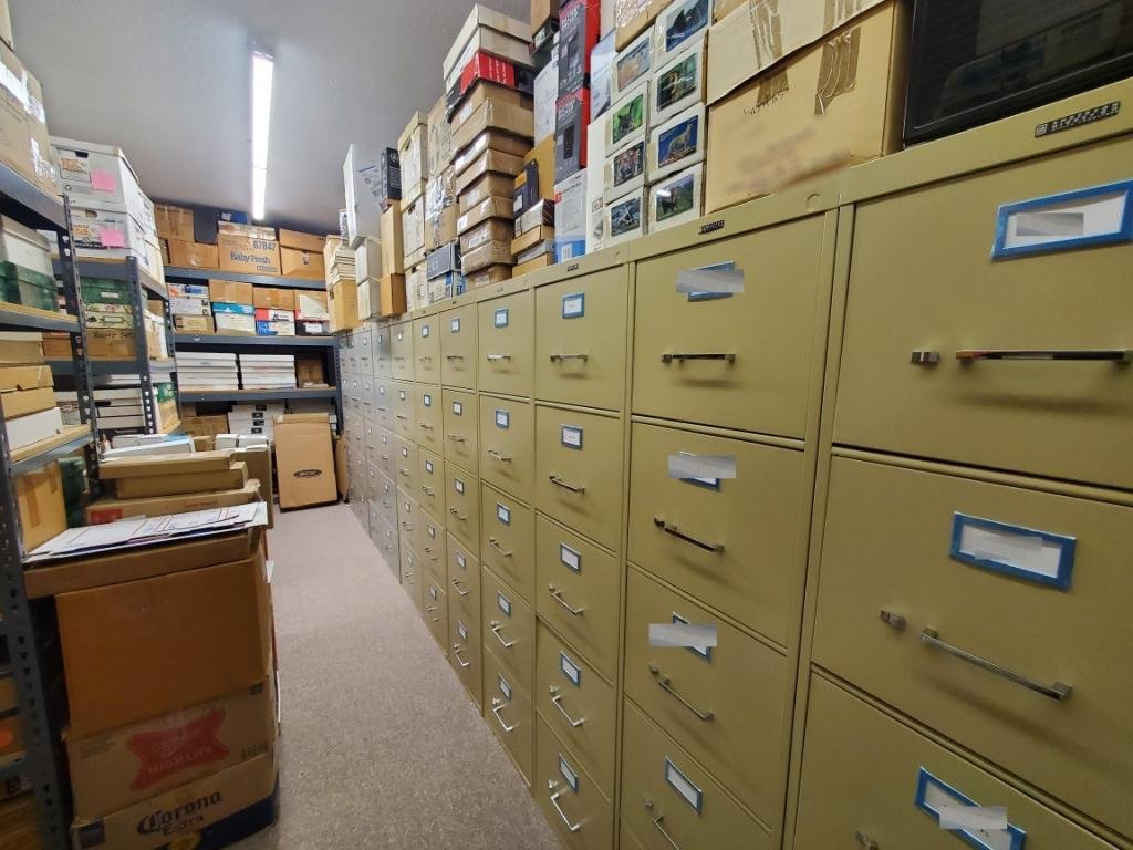 Rows of filing cabinets holding part of Steve Schwartz's catalogued phonecard archive