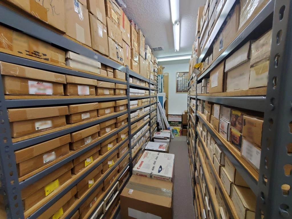 Aisles of shelving with thousands of boxes of phonecards in Steve Schwartz's inventory