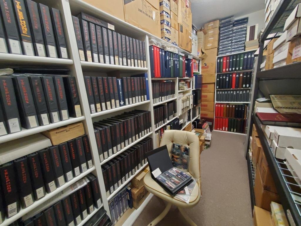 Steve Schwartz's phonecard reference collection: shelves of binders holding one example of every USA issue from 1984 to 2000