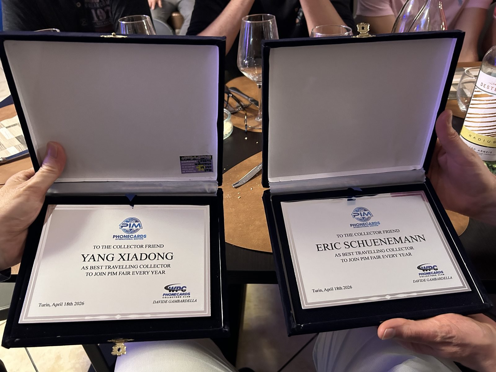 The commemorative plaques presented to Yang Xiaodong and Eric Schuenemann at PIM 2026 in Turin