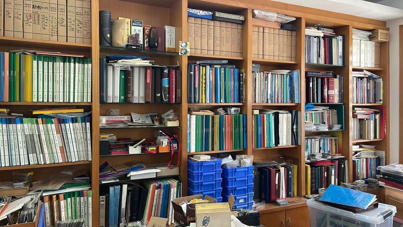 The library of Yang Xiaodong's phonecard collection, with albums, catalogues and numbered archive boxes