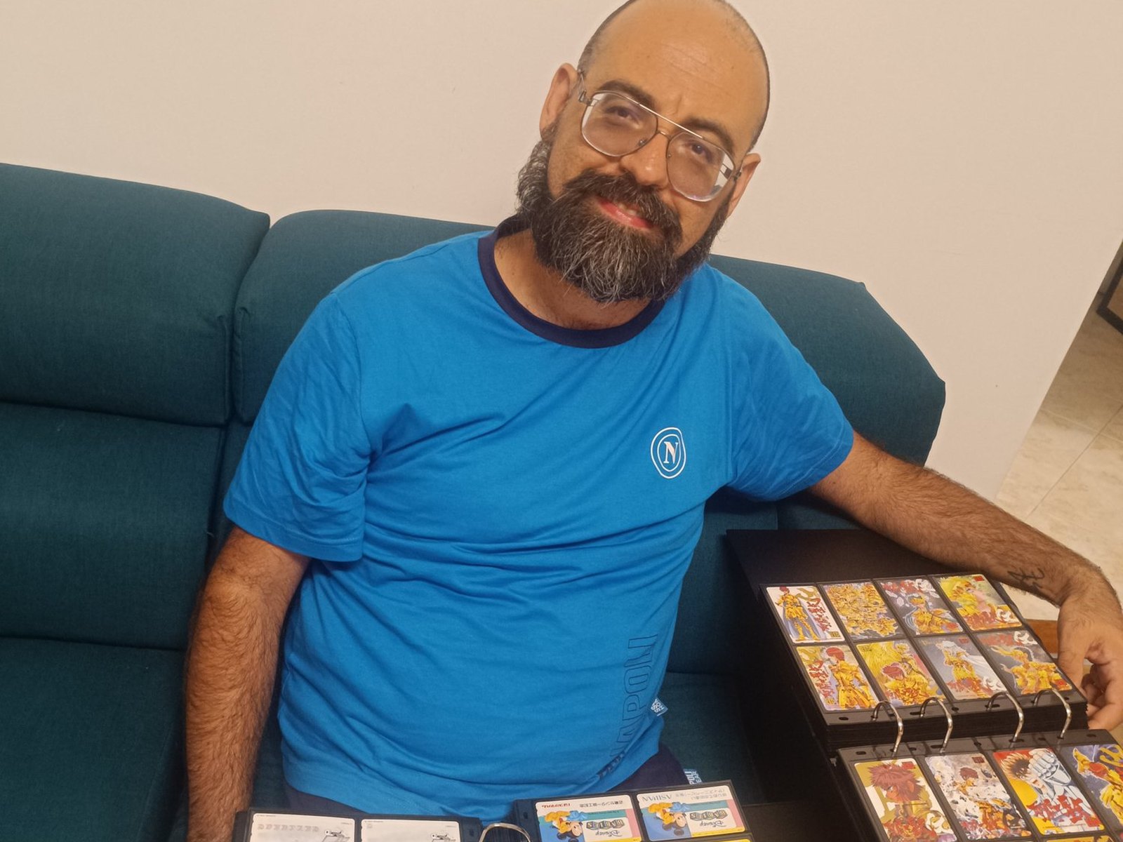 Giuseppe Perrotti with the albums of his Japanese Disney, anime and manga phonecard collection